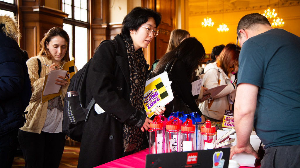 Students at a welcome fair looking around the stalls.